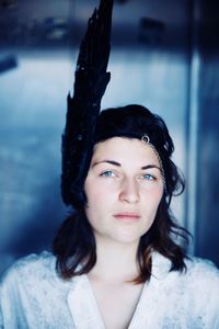 Portrait of beautiful young woman wearing headwear