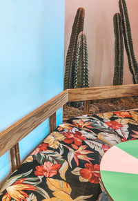 High angle view of flowering plants on table against wall