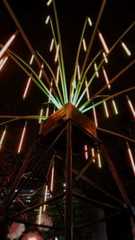 Low angle view of illuminated lights at night