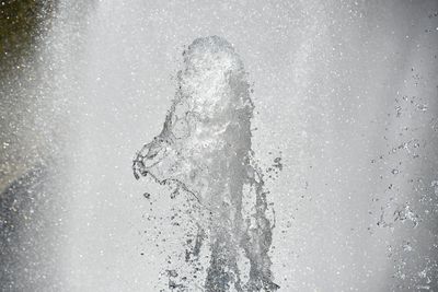 Close-up of water splashing against black background