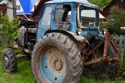 Abandoned car on field