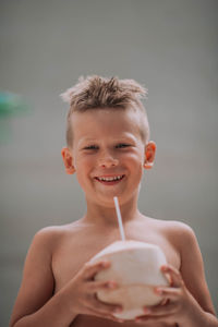 Portrait of smiling boy holding ice cream