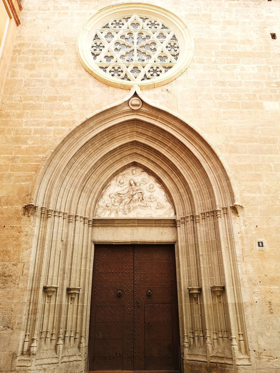 LOW ANGLE VIEW OF CLOSED DOOR ON BUILDING