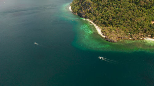Tropical lagoon with sandy beach, aerial view. el nido, philippines, palawan. 