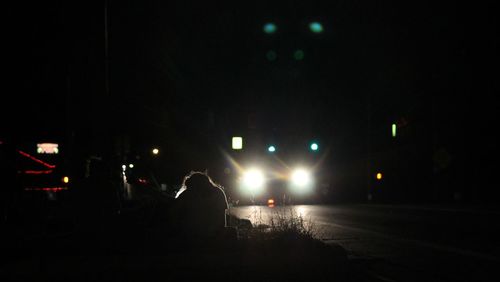 View of illuminated people at night