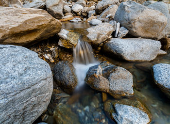 Close-up of stones in water