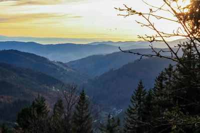 Scenic view of mountains against sky at sunset