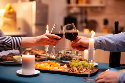 Cropped hand of woman having food