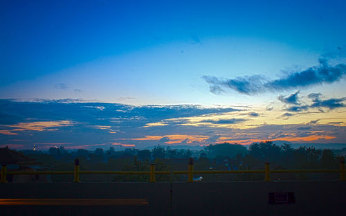 Scenic view of landscape against blue sky