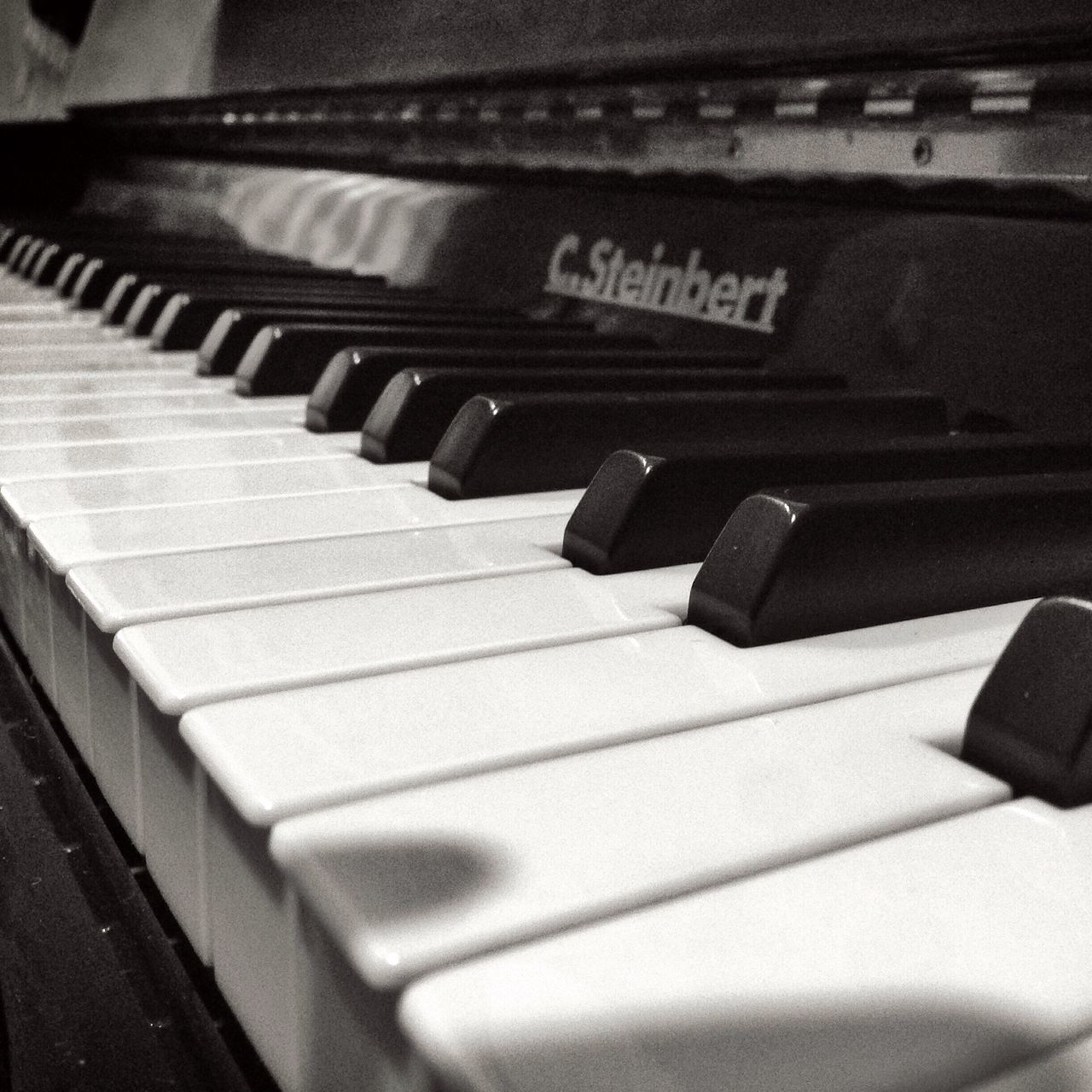 indoors, music, close-up, arts culture and entertainment, piano key, musical instrument, communication, technology, musical equipment, piano, selective focus, high angle view, in a row, still life, text, part of, no people, focus on foreground, number, connection