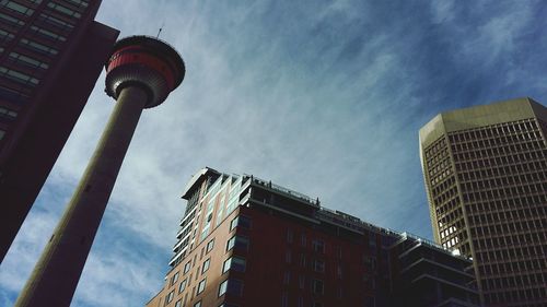 Low angle view of tower against cloudy sky