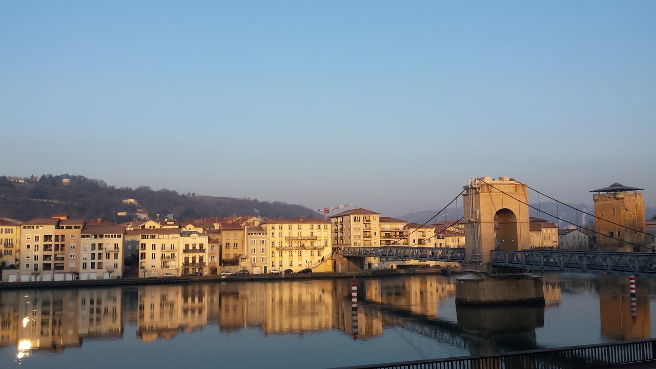 architecture, water, built structure, building exterior, reflection, waterfront, river, city, bridge - man made structure, connection, no people, outdoors, sky, nature, day