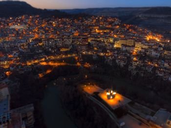 High angle view of illuminated buildings in city at night