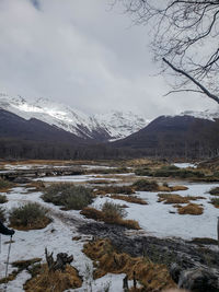 Scenic view of snowcapped mountains against sky