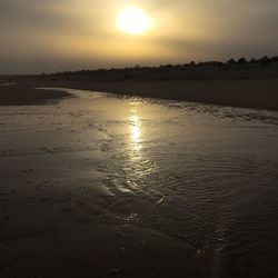 Scenic view of sea at sunset