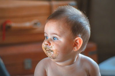 Close-up toddler boy with dirt on face