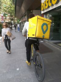 Man riding bicycle on road