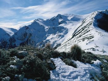 Scenic view of snowcapped mountains against sky