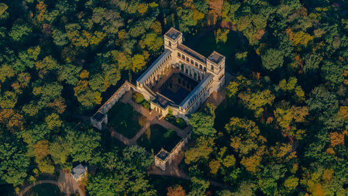 High angle view of old building amidst trees