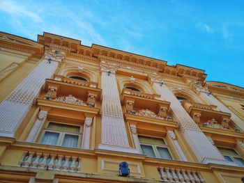 Low angle view of historical building against blue sky