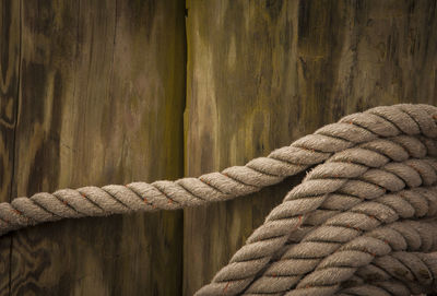 Close-up of rope tied on wood