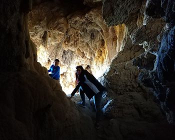 People enjoying in cave