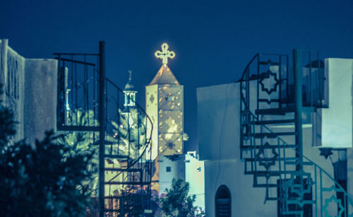 Illuminated city against sky