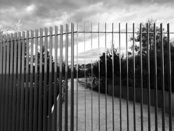 Panoramic view of metal fence against sky