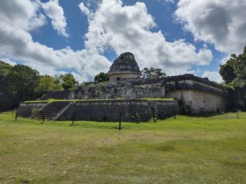 Old ruins of temple against cloudy sky