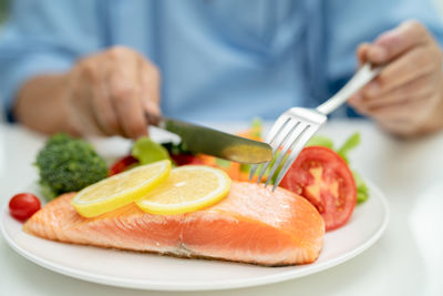 Midsection of man having food
