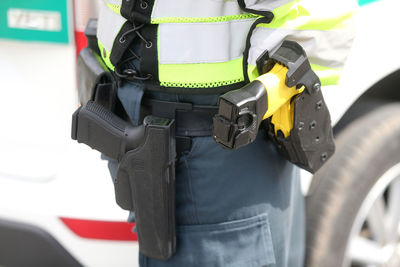 Rear view of man standing on road