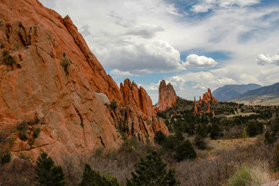 Scenic view of mountains against cloudy sky