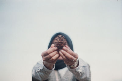 Portrait of man wearing mask against white background