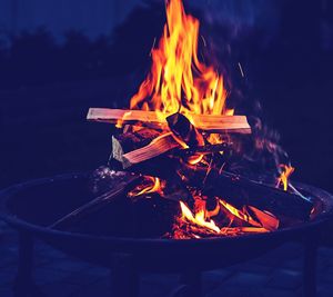 Close-up of fire burning at night