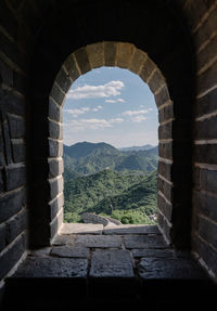 View of historical building through arch window