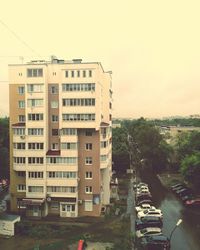 Residential buildings in city against sky