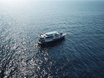 High angle view of boat sailing on sea against sky