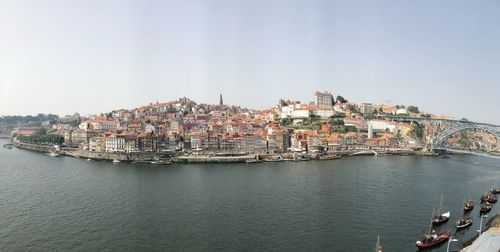 Panoramic view of sea and buildings against sky