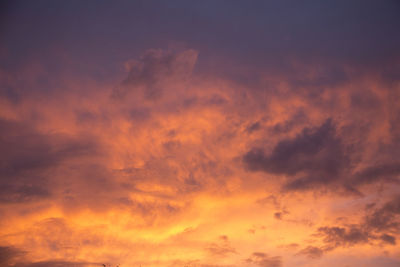 Low angle view of dramatic sky during sunset