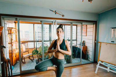 Young woman exercising in gym