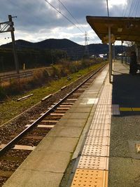 Railroad station platform against sky