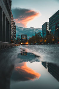Scenic view of city against sky during sunset