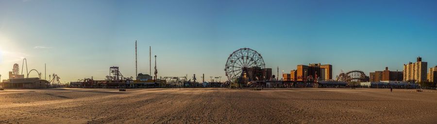 Panoramic view of amusement park on beach at coney island