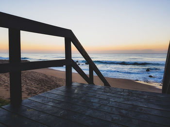 Scenic view of sea against clear sky during sunset