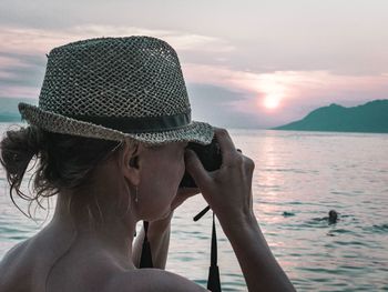 Portrait of woman looking at sea