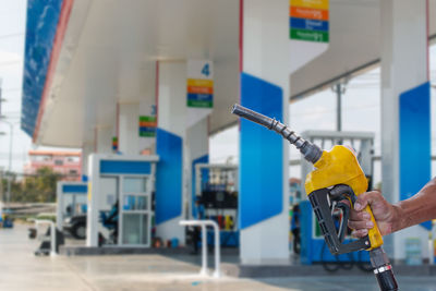 Cropped hand of man holding equipment