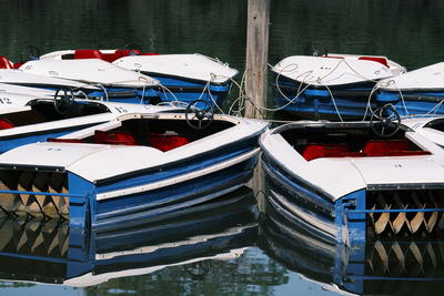 High angle view of fishing boats moored at harbor