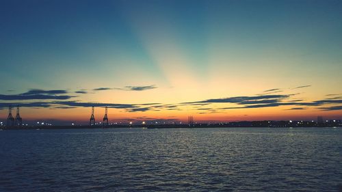 Scenic view of sea against sky at dusk