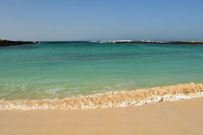 Scenic view of sea against clear sky