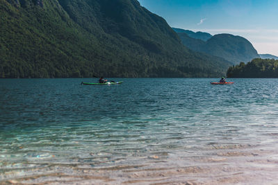 Scenic view of sea against mountains